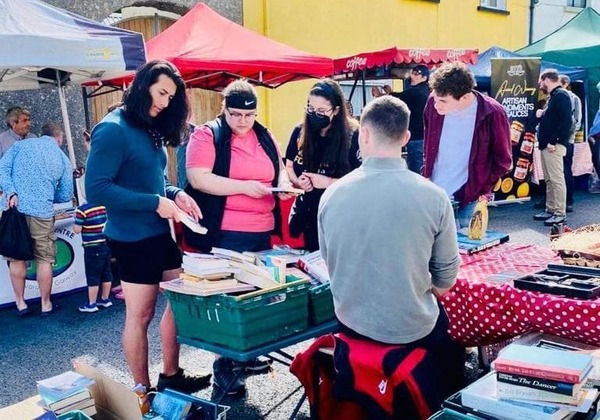 Creative Writing Students Buying Used Books At Irish Street Fair